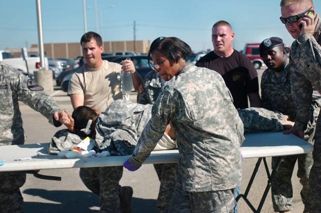 Fort Hood Shooting 13 Dead 30 Wounded Nov. 05, 2009 - Fort Hood, Texas, U.S. - First responders use a table as a stretcher to transport a wounded Soldier to an awaiting ambulance at Fort Hood. Copyright: xSgt.xJasonxR.xKrawczykx