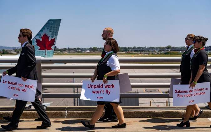 August 11, 2025, Montreal, Pq, CANADA: Air Canada flight attendants hold a silent protest at Montreal-Pierre Elliott Trudeau International Airport in Montreal on Monday, Aug. 11, 2025. Montreal CANADA  - ZUMAc35_ 20250811_zaf_c35_002 Copyright: xChristinnexMuschix