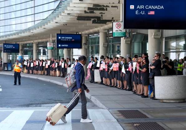 August 11, 2025, Toronto, On, CANADA: Air Canada flight attendants gather for a demonstration in preparation for a possible strike at Pearson International Airport in Toronto, on Monday, Aug. 11, 2025. Toronto CANADA  - ZUMAc35_ 20250811_zaf_c35_014 Copyright: xNathanxDenettex