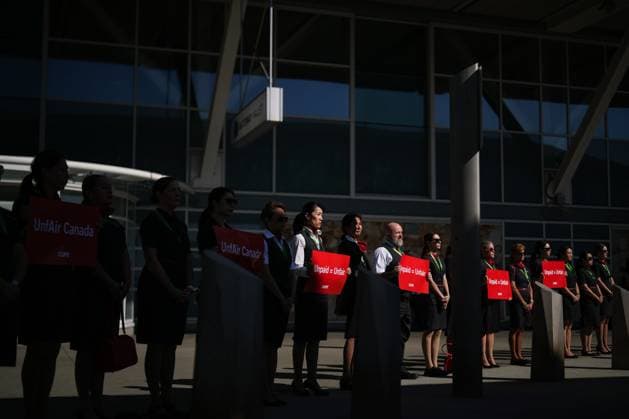 August 11, 2025, Richmond, Bc, CANADA: Air Canada flight attendants stand during a silent protest at Vancouver International Airport on a national day of action, as labour negotiations between the Canadian Union of Public Employees and the airline continue, in Richmond, B.C., on Monday, Aug. 11, 2025. Richmond CANADA - ZUMAc35_ 20250811_zaf_c35_028 Copyright: xDarrylxDyckx