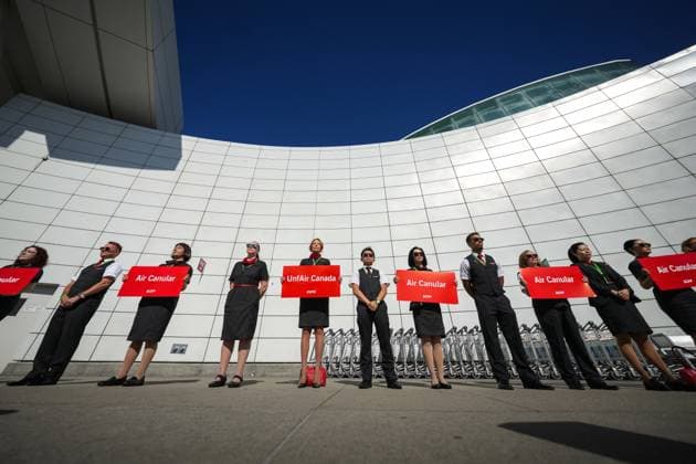 August 11, 2025, Richmond, Bc, CANADA: Air Canada flight attendants stand during a silent protest at Vancouver International Airport on a national day of action, as labour negotiations between the Canadian Union of Public Employees and the airline continue, in Richmond, B.C., on Monday, Aug. 11, 2025. Richmond CANADA - ZUMAc35_ 20250811_zaf_c35_041 Copyright: xDarrylxDyckx