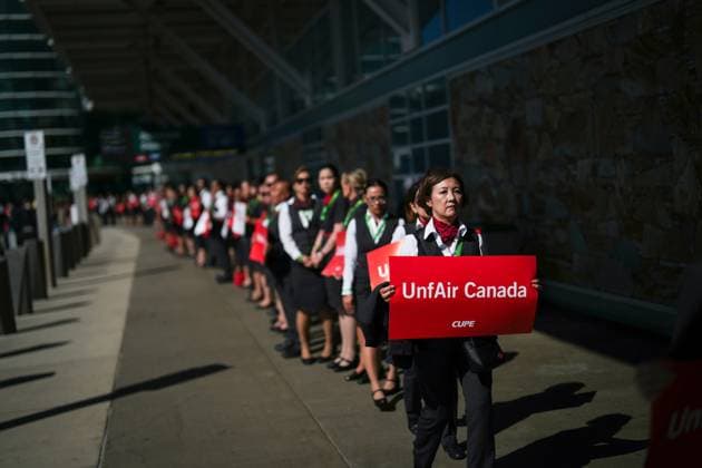 August 11, 2025, Richmond, Bc, CANADA: Air Canada flight attendants march together as they leave after holding a silent protest at Vancouver International Airport on a national day of action, as labour negotiations between the Canadian Union of Public Employees and the airline continue, in Richmond, B.C., on Monday, Aug. 11, 2025. Richmond CANADA - ZUMAc35_ 20250811_zaf_c35_046 Copyright: xDarrylxDyckx