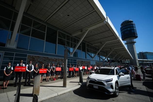 August 11, 2025, Richmond, Bc, CANADA: Air Canada flight attendants stand during a silent protest at Vancouver International Airport on a national day of action, as labour negotiations between the Canadian Union of Public Employees and the airline continue, in Richmond, B.C., on Monday, Aug. 11, 2025. Richmond CANADA - ZUMAc35_ 20250811_zaf_c35_047 Copyright: xDarrylxDyckx