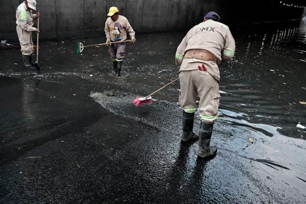 August 11, 2025, Mexico, Cdmx, Mexico: In the Venustiano Carranza region, very close to Mexico City International Airport (AICM), flooding occurred due to recent heavy rains. The vehicles transported to the airport were affected, especially under bridges, where rainwater and sewage from the sewers covered some cars, preventing their owners from getting them out in time. Mexico City sanitation and water workers are working constantly using machinery to remove water from these tunnels and unclog the sewers to remove vehicles that have been totally lost. Mexico Mexico - ZUMAp204 20250811_zip_p204_049 Copyright: xJosuexPerezx