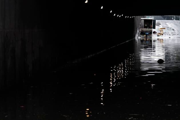 August 11, 2025, Mexico, Cdmx, Mexico: In the Venustiano Carranza region, very close to Mexico City International Airport (AICM), flooding occurred due to recent heavy rains. The vehicles transported to the airport were affected, especially under bridges, where rainwater and sewage from the sewers covered some cars, preventing their owners from getting them out in time. Mexico City sanitation and water workers are working constantly using machinery to remove water from these tunnels and unclog the sewers to remove vehicles that have been totally lost. Mexico Mexico - ZUMAp204 20250811_zip_p204_052 Copyright: xJosuexPerezx