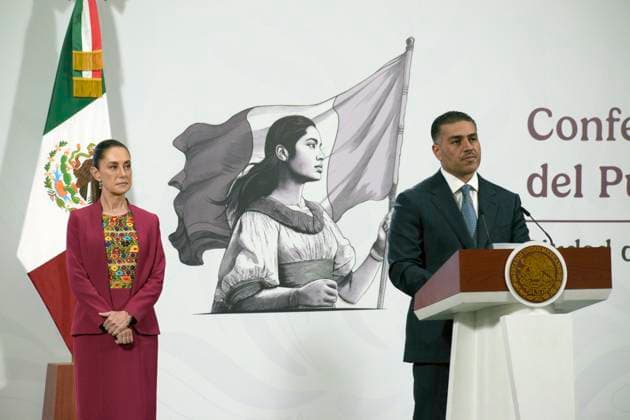 Mexican President Claudia Sheinbaum Pardo is seen behind while Secretary of Security and Citizen Protection, Omar Garcia Harfuch speak during the security report at a briefing conference at National Palace. on August 12, 2025 in Mexico City, Mexico. Mexico City Mexico - ZUMAe321 20250812_zia_e321_009 Copyright: xLuisxBarronx