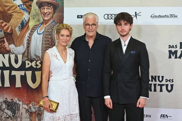 Sky DU MONT actor with companion Julia SCHUETZE and son Fayn movie premiere DAS KANU DES MANITU on 12 08 2025 at the Mathaeser Kino in Munich