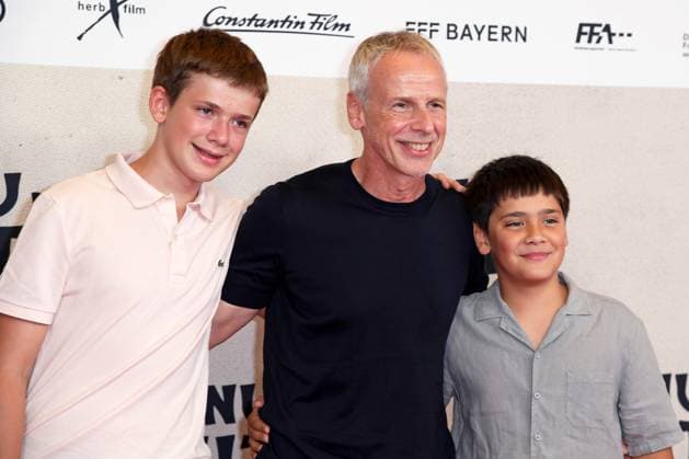 Fred Kogel CEO Leonine with sons Leo Kogel and Ortiz Kogel at the world premiere of the movie DAS KANU DES MANITU at the Mathäser Filmpalast in Munich on 12 08 2025
