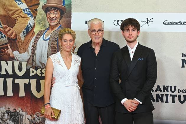 Sky DU MONT actor with companion Julia SCHUETZE and son Fayn movie premiere DAS KANU DES MANITU on 12 08 2025 at the Mathaeser Kino in Munich