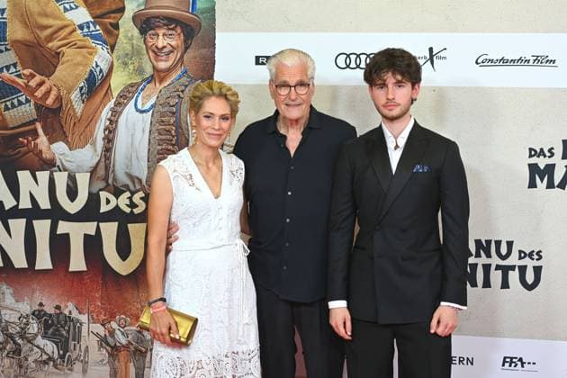 Sky DU MONT actor with companion Julia SCHUETZE and son Fayn movie premiere DAS KANU DES MANITU on 12 08 2025 at the Mathaeser Kino in Munich