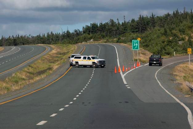 August 13, 2025, St. John s, Nl, Canada: Traffic is diverted as the Trans Canada Highway remains closed outside of St. John s N.L. due to a wildfire in the Paddy s Pond area on Wednesday, August 13, 2025. St. John s Canada  - ZUMAc35_ 20250813_zaf_c35_132 Copyright: xPaulxDalyx
