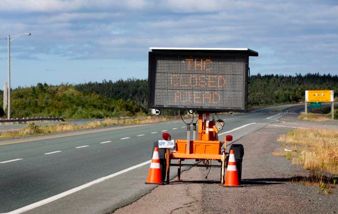 August 13, 2025, St. John s, Nl, Canada: Traffic is diverted as the Trans Canada Highway remains closed outside of St. John s N.L. due to a wildfire in the Paddy s Pond area on Wednesday, August 13, 2025. St. John s Canada  - ZUMAc35_ 20250813_zaf_c35_135 Copyright: xPaulxDalyx
