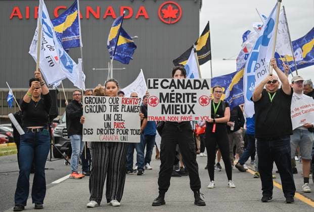 August 17, 2025, Montreal, Pq, Canada: Air Canada employees and union members protest outside the Air Canada headquarters in Montreal, Sunday, Aug. 17, 2025, after the federal government intervened in the labour dispute between the airline and the union representing its flight attendants, ordering binding arbitration and operations to resume. Montreal Canada  - ZUMAc35_ 20250817_zaf_c35_017 Copyright: xGrahamxHughesx