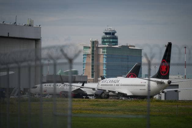 August 18, 2025, Richmond, Bc, CANADA: Air Canada aircraft sit parked at Vancouver International Airport, in Richmond, B.C., on Monday, August 18, 2025. The Canadian Union of Public Employees says a strike by 10,000 flight attendants at Air Canada will continue, defying an order from the Canada Industrial Relations Board that it provide public notice by noon ET Monday that it had ended the strike. Richmond CANADA - ZUMAc35_ 20250818_zaf_c35_085 Copyright: xDarrylxDyckx
