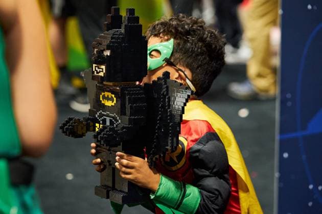 August 22, 2025, Toronto, On, Canada: A young convention-goer holds up a LEGO Batman on the second day of the annual Fan Expo convention in Toronto, on Friday, Aug. 22, 2025. Toronto Canada  - ZUMAc35_ 20250822_zaf_c35_157 Copyright: xSammyxKoganx