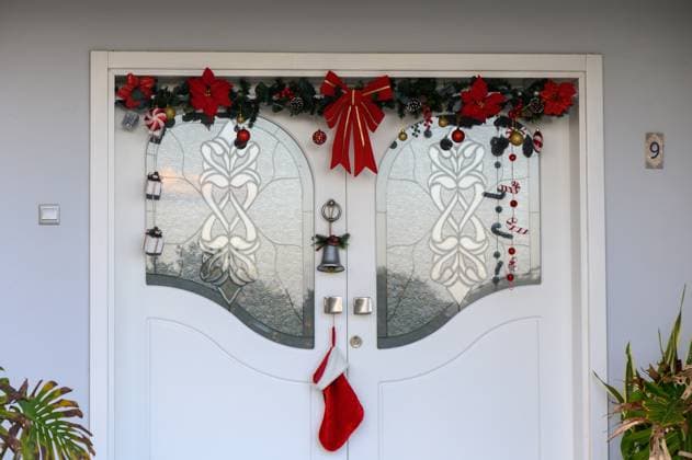 Festive holiday door adorned with vibrant decorations and seasonal cheer Festively decorated doors brighten the holiday spirit with colorful ornaments and cheerful touches., 63840958.jpg RECORD DATE NOT STATED