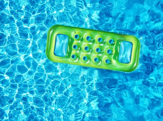 Inflatable mattress in swimming pool From above drone view of bright green inflatable mattress floating on blue water surface of swimming pool in sunlight in summertime, 64540620.jpg RECORD DATE NOT STATED