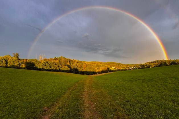 Summer evening in Siegerland In the evening a rainbow appears over the town of Siegen Oberschelden Summer in Siegerland on 26 08 2025 in Siegen Germany