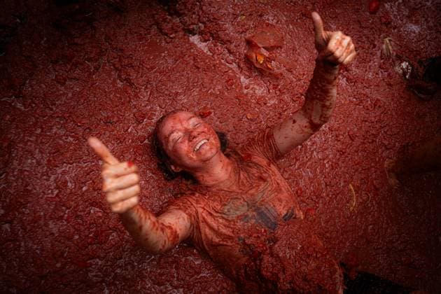 Celebration of La Tomatina de Bunol Valencia 2025 A woman during the Tomatina de Bunol 2025 festival, on August 27, 2025, in Bunol, Valencia, Valencian Community Spain This year, more than 22 000 people are expected to participate, throwing some 150 000 kilos of tomatoes during one hour in the center of the town This is the 80th edition of this internationally famous festival that takes place on the last Wednesday of August 27 AUGUST 2025 TOMATINA BUÑOL FIESTA TOMATOES Valencia Valencian Community Valencia Valencian Community Valencian Community Spain  Copyright: xJorgexGilx 6917905