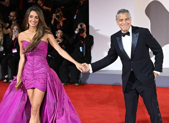 American actor George Clooney and British lawyer Amal Clooney attend the premiere of Jay Kelly at the 82nd Venice Film Festival in Venice, Italy on Thursday, August 28, 2025.  VEN202508281103 RUNExHELLESTAD