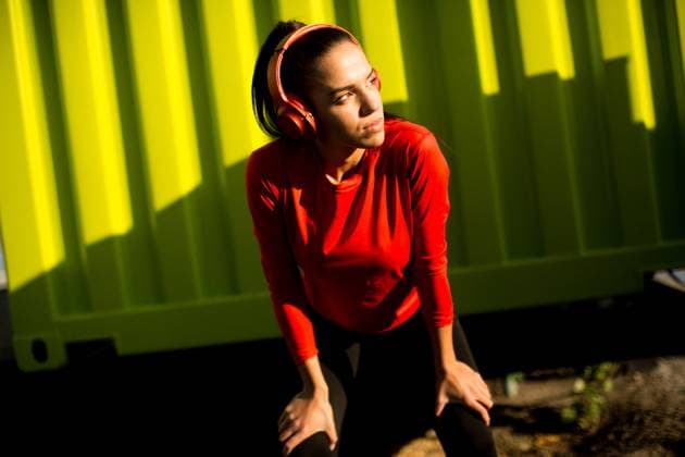 Young attractive female runner taking break after jogging outdoors Attractive female runner taking break after jogging outdoors, model released, , 95307020.jpg RECORD DATE NOT STATED