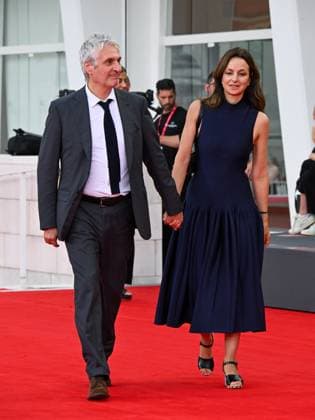 Venice, ITALY: Venice, 82nd Venice International Film Festival 2025 - Evening 3 - Red Carpet for the film A Pied D Oeuvre - Pictured: Alain Goldman and Eliette AbÃ cassis Venice ITALY  - ZUMAp169 20250829_zea_p169_675 Copyright: xManuelexMangiarottix