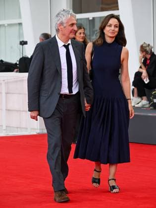 Venice, ITALY: Venice, 82nd Venice International Film Festival 2025 - Evening 3 - Red Carpet for the film A Pied D Oeuvre - Pictured: Alain Goldman and Eliette AbÃ cassis Venice ITALY  - ZUMAp169 20250829_zea_p169_676 Copyright: xManuelexMangiarottix