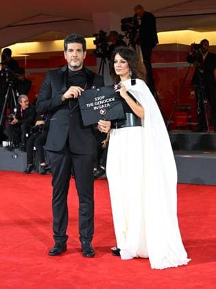 Venice, Italy: Venice, 82nd Venice International Film Festival 2025 - Evening 3 - The Red Carpet for the film Calle Malaga. Pictured: Stop the Genocide in Gaza: Nabil Ayouch, Maryam Touzani Venice Italy  - ZUMAp169 20250829_zea_p169_1329 Copyright: xManuelexMangiarottix