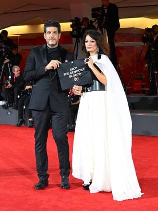 Venice, Italy: Venice, 82nd Venice International Film Festival 2025 - Evening 3 - The Red Carpet for the film Calle Malaga. Pictured: Stop the Genocide in Gaza: Nabil Ayouch, Maryam Touzani Venice Italy  - ZUMAp169 20250829_zea_p169_1334 Copyright: xManuelexMangiarottix