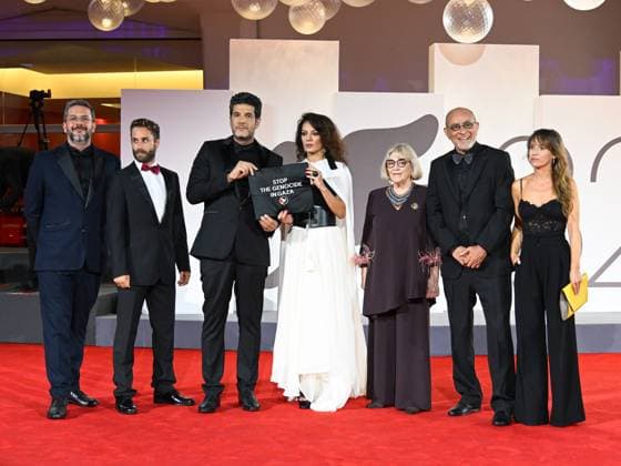 Venice, Italy: Venice, 82nd Venice International Film Festival 2025 - Evening 3 - The Red Carpet for the film Calle Malaga. Pictured: Stop the Genocide in Gaza: Nabil Ayouch, Maryam Touzani, Carmen Maura, Ahmed Boulane, and Marta Etura. Venice Italy  - ZUMAp169 20250829_zea_p169_1336 Copyright: xManuelexMangiarottix