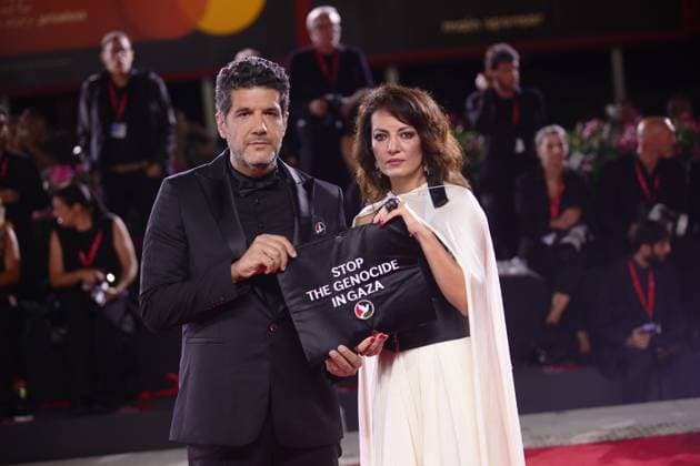 82nd Venice Film Festival - Eojjeol suga eopda (No Other Choice) VENICE, ITALY - AUGUST 29: Director Maryam Touzani and producer Nabil Ayouch display a pro-Palestine sign at the red carpet of the film Eojjeol suga eopda (No Other Choice) at the 82nd Venice Film Festival in Venice, Italy on August 29th, 2025. Marco Barada Anadolu Venice Italy. Editorial use only. Please get in touch for any other usage.  Copyright: x2025xAnadoluxMarcoxBaradax