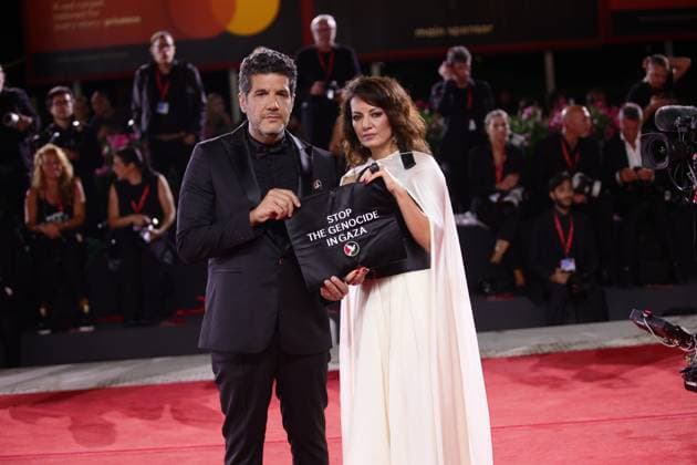 82nd Venice Film Festival - Eojjeol suga eopda (No Other Choice) VENICE, ITALY - AUGUST 29: Director Maryam Touzani and producer Nabil Ayouch display a pro-Palestine sign at the red carpet of the film Eojjeol suga eopda (No Other Choice) at the 82nd Venice Film Festival in Venice, Italy on August 29th, 2025. Marco Barada Anadolu Venice Italy. Editorial use only. Please get in touch for any other usage.  Copyright: x2025xAnadoluxMarcoxBaradax