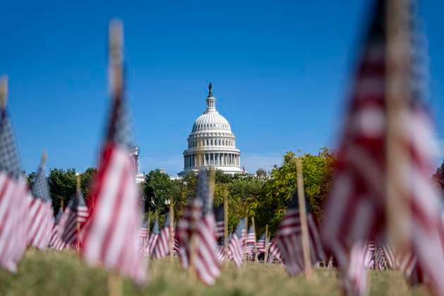 American flags are placed in the grass outside the Department of Labor headquarters near the U.S. Capitol building during Labor Day weekend in Washington, DC on Saturday, August 30, 2025.  WAP20250830328 BONNIExCASH