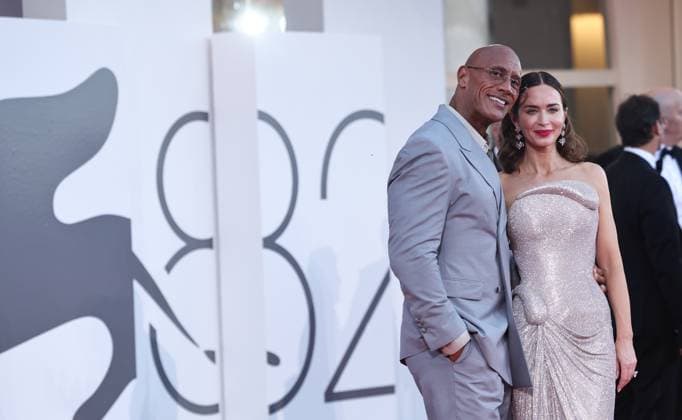 (250901) -- VENICE (ITALY), Sept. 1, 2025 -- Dwayne Johnson (L) and Emily Blunt pose at the red carpet before the premiere of the film Smashing Machine during the 82nd Venice Film Festival in Venice, Italy, Sept. 1, 2025. ) ITALY-VENICE-FILM FESTIVAL-SMASHING MACHINE-PREMIERE LixJing 