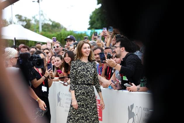 September 2, 2025, Venice, Veneto, Italy: SOFIA COPPOLA signs autographs for her fans on the red carpet for Marc by Sofia Premiere screening at the 82nd Venice Film Festival at the Venice Lido, Italy. Venice Italy - ZUMAc179 20250902_zep_c179_006 Copyright: xMickaelxChavetx