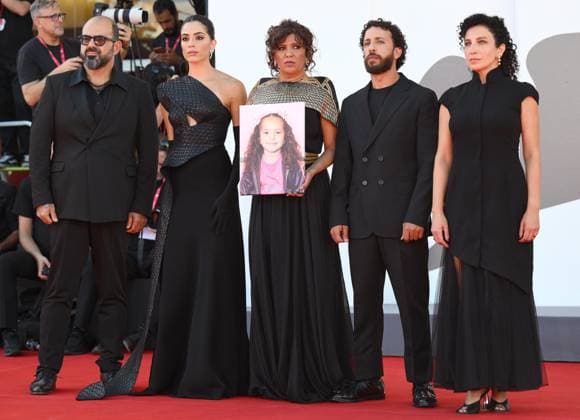 September 3, 2025, Venice, ITALY: (L-R) Palestinian actor Amer Hlehel, Jordanian-Canadian actor Saja Kilani, Tunisian director Kaouther Ben Hania, Palestinian actor Motaz Malhees, and Palestinian-Israeli actor Clara Khoury show a picture of Hind Rajab as they arrive for the premiere of The Voice of Hind Rajab during the 82nd Venice Film Festival in Venice, Italy, 03 September 2025. The movie is presented in official competition Venezia 82 at the festival running from 27 August to 06 September 2025. ANSA ETTORE FERRARI. Venice ITALY  - ZUMAa110 20250903_zaf_a110_035 Copyright: xEttorexFerrarix