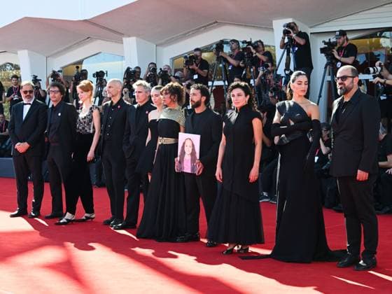 Venice, ITALY: Venice, 82nd Venice International Film Festival 2025 - day 8 - red carpet of the film The Voice Of Hind Rajab - In the photo, the cast with the portrait of little Hind Rami Iyad Rajab Venice ITALY  - ZUMAp169 20250903_zea_p169_865 Copyright: xManuelexMangiarottix