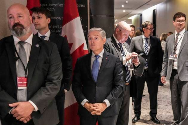 September 3, 2025, Toronto, On, CAN: Minister of Finance and National Revenue Francois-Phillipe Champagne, centre, listens as Prime Minister Mark Carney speaks to the media at the Liberal Cabinet Retreat in Toronto, Wednesday, Sept. 3, 2025. Toronto CAN  - ZUMAc35_ 20250903_zaf_c35_027 Copyright: xChrisxYoungx