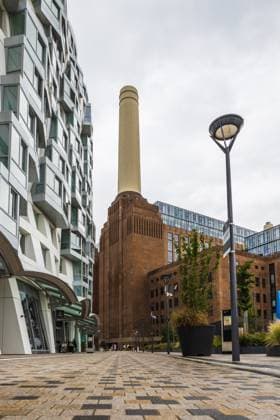 Battersea Power Station. Iconic Landmark and Architecture. London, UK, 4 July 2023 View of London famous Battersea Power Station, emphasizing its tall chimney and brick structure against a cloudy sky. London, UK, 4 July 2023, 64966990.jpg RECORD DATE NOT STATED