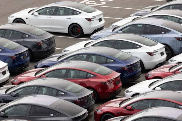 Imported Tesla cars are parked on Daikokufuto island inside Tokyo Bay.  aflo_302204911