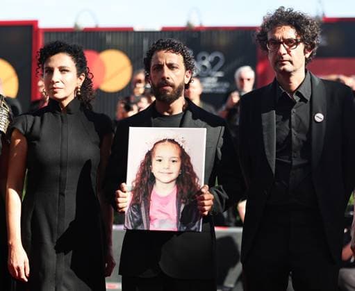 (250904) -- VENICE, Sept. 4, 2025 -- Crews members Clara Khoury, Motaz Malhees, Nadim Cheikhrouha (from L to R) of the film The Voice of Hind Rajab arrive at the red carpet of the premiere during the 82nd Venice Film Festival in Venice, Italy, Sept. 3, 2025. ) ITALY-VENICE-FILM FESTIVAL-THE VOICE OF HIND RAJAB-PREMIERE LixJing 