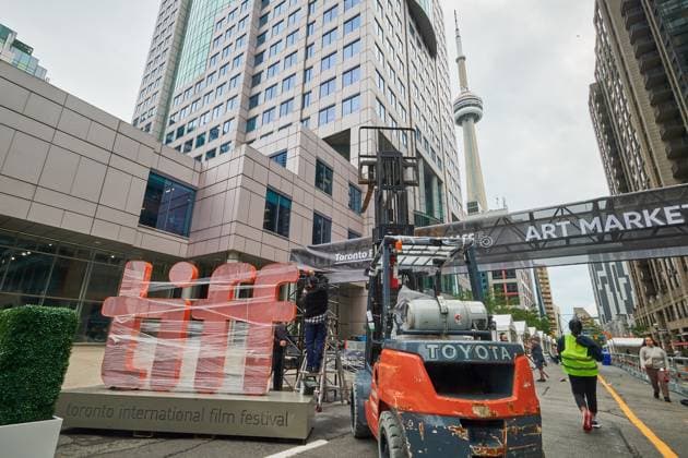 September 4, 2025, Toronto, On, Canada: Pedestrians walk by a covered TIFF sign as preparations for the Toronto International Film Festival continue in Toronto, on Thursday, Sept. 4, 2025. Toronto Canada  - ZUMAc35_ 20250904_zaf_c35_054 Copyright: xSammyxKoganx