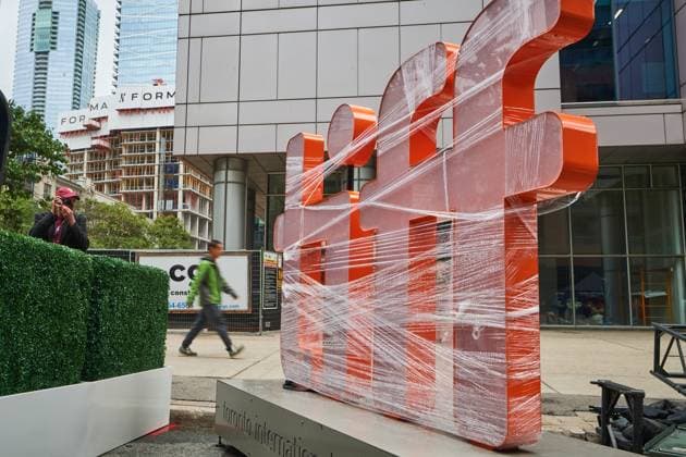 September 4, 2025, Toronto, On, Canada: Pedestrians walk by a covered TIFF sign as preparations for the Toronto International Film Festival continue in Toronto on Thursday, Sept. 4, 2025. Toronto Canada  - ZUMAc35_ 20250904_zaf_c35_051 Copyright: xSammyxKoganx