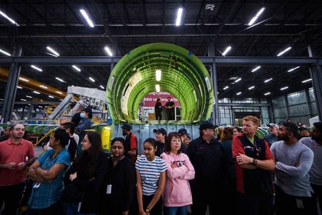 September 5, 2025, Mississauga, On, Canada: Workers at a manufacturing facility stand in front of a airplane shell under construction as they wait for Prime Minister Mark Carney to speak at a press conference in Mississauga, Ont., on Friday, Sept. 5, 2025. Mississauga Canada  - ZUMAc35_ 20250905_zaf_c35_026 Copyright: xSammyxKoganx