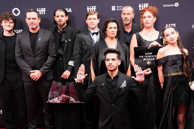 2025 Toronto International Film Festival - Palestine 36 TORONTO, CANADA - SEPTEMBER 5 : A guest, wearing pin of Palestine, poses with the words Stop the Genocide written on his hands as cast and crew attend the premiere of ‘Palestine 36’ during the 2025 Toronto International Film Festival at Roy Thomson Hall in Toronto, Ontario, Canada on September 5, 2025. Mert Alper Dervis Anadolu Ontario Canada. Editorial use only. Please get in touch for any other usage.  Copyright: x2025xAnadoluxMertxAlperxDervisx
