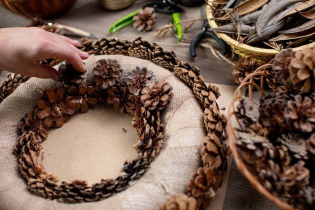 Creating a Lovely Natural Pinecone Wreath Perfect for Enhancing a Rustic Home Decor Handcrafting a cozy and beautiful pinecone wreath using natural elements for lovely seasonal decoration, 94636862.jpg RECORD DATE NOT STATED