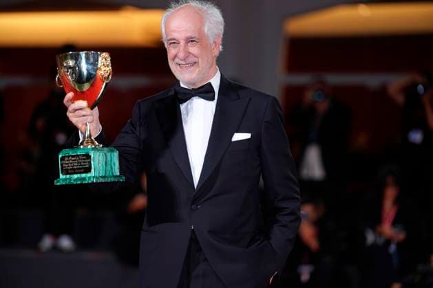 Toni Servillo poses with the Coppa Volpi for Best Actor for La Grazia during the winners photocall at the 82nd Venice International Film Festival in Venice, Italy on Saturday, September 6, 2025.  VEN20250906928 RoccoxSpaziani