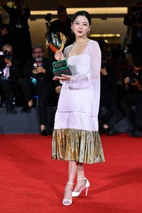 Venice Winners Red Carpet AM Xin Zhilei poses with the Coppa Volpi for Best Actress for The Sun Rises on Us All attending the Winners Red Carpet of the 82nd Venice International Film Festival at the Lido in Venice, Italy on September 06, 2025. Photo by Aurore Marechal ABACAPRESS.COM Venice Italy  Copyright: xMarechalxAurore ABACAx