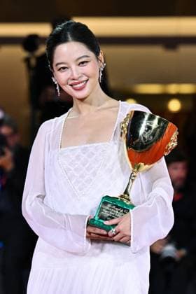 Venice Winners Red Carpet AM Xin Zhilei poses with the Coppa Volpi for Best Actress for The Sun Rises on Us All attending the Winners Red Carpet of the 82nd Venice International Film Festival at the Lido in Venice, Italy on September 06, 2025. Photo by Aurore Marechal ABACAPRESS.COM Venice Italy  Copyright: xMarechalxAurore ABACAx