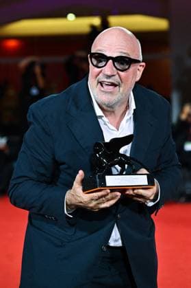 Venice Winners Red Carpet AM Gianfranco Rosi poses with the Special Jury Prize for Below the Clouds attending the Winners Red Carpet of the 82nd Venice International Film Festival at the Lido in Venice, Italy on September 06, 2025. Photo by Aurore Marechal ABACAPRESS.COM Venice Italy  Copyright: xMarechalxAurore ABACAx
